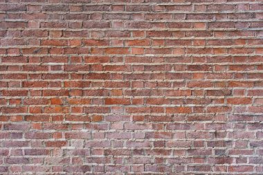 Kırmızının farklı renklerinde desenli kırmızı tuğla duvar