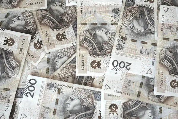 Polish banknotes of 200 zloty denomination, symbol of money, inflation, financial crisis, cash, economy, paper money, circulating banknotes, finance, monetary value, Poland.