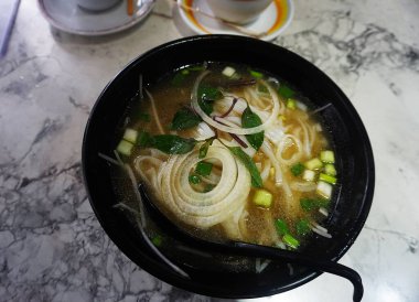 Traditional restaurant in Hong Kong serving a healthy Pao soup (or similar local variety). A fragrant broth filled with vegetables and herbs, popular in Asian cuisine as a light and nutritious dish.