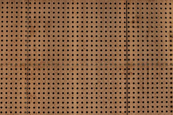 Paslı delikli metal duvar. Soyut arkaplan. Yüksek kalite fotoğraf