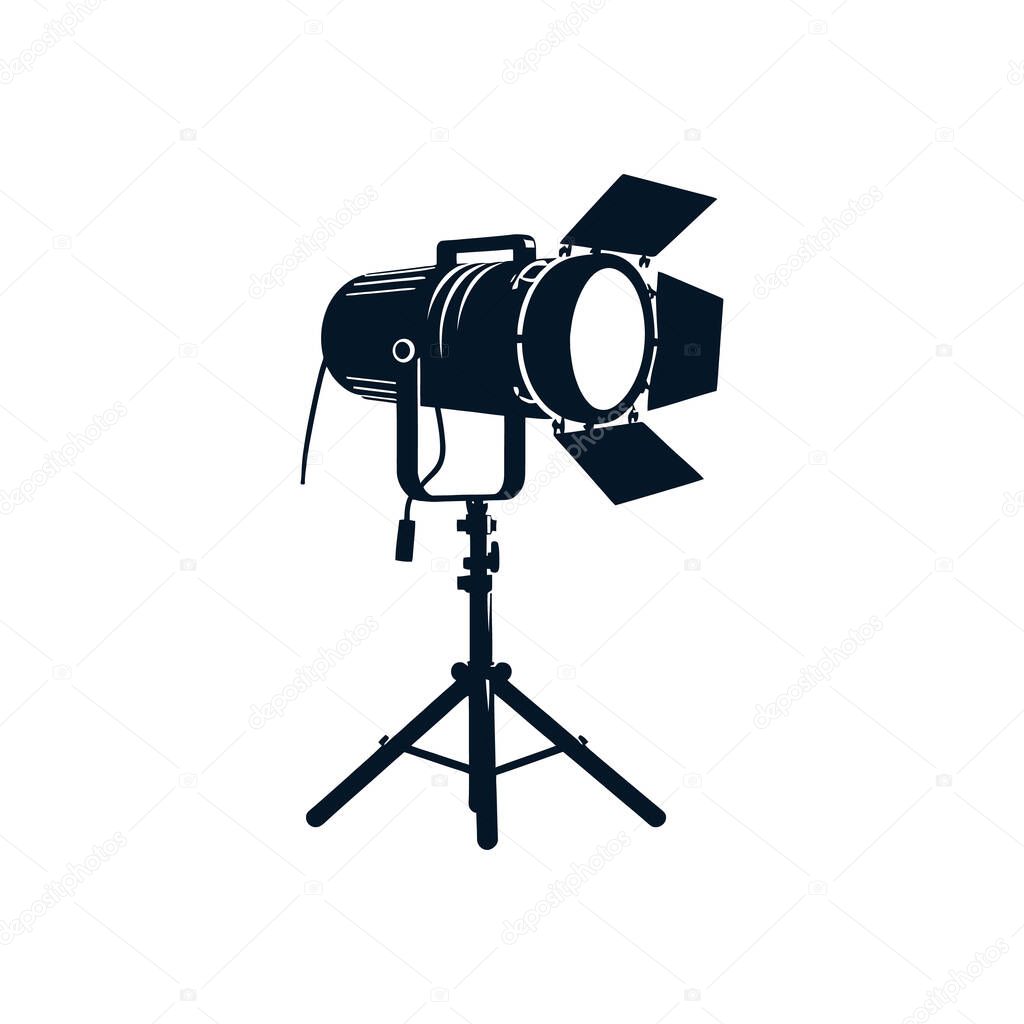 Professional studio spotlight on a tripod stand a vector icon for a film set or photography studio black and white lighting equipment silhouette