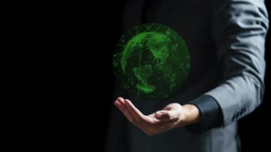 Dünya gezegenini elinde tutan iş adamı. Bu görüntünün unsurları Nasa tarafından desteklenmektedir