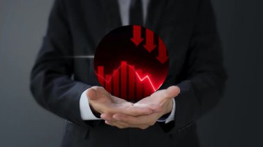 İşadamı kırmızı grafik tutuyor