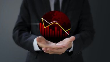 İş adamı elinde iş grafiği, iş konsepti olan bir grafik tutuyor..