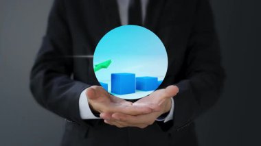 İş adamı elinde iş grafiğiyle dijital tablet tutuyor