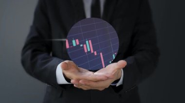 Grafik borsası, borsa ticareti ve mali yatırım konsepti olan işadamı grafiği tutuyor