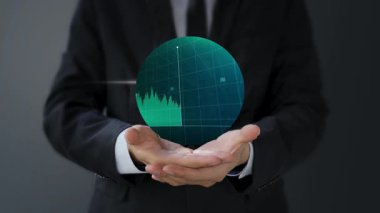 Bir küreyi tutan iş adamı.