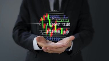 Sanal ekranda iş adamı eli borsa grafiğine dokunuyor