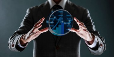 işadamı ile elden gelen finansal simgeler