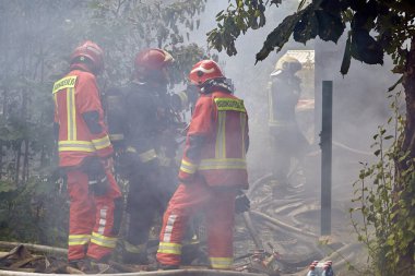 August 8, 2022, Riga, Latvia: extinguishing the fire destroyed the village house