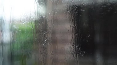 Rainy day window view relaxing rain sounds and blurred background