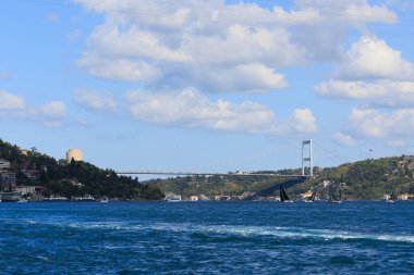 sailboats are racing under the cloudy sky and Fatih Sultan Mehmet Bridge in 24th Bosphorus Cup on 20 September 2025