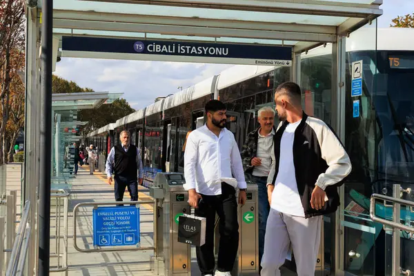 people is getting off the cibali tram at the cibali station in istanbul, Eminent - Alibeykoy tram
