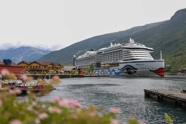 Cruise ship docked in the port of Flam in summer in Sognefjord, Norway.