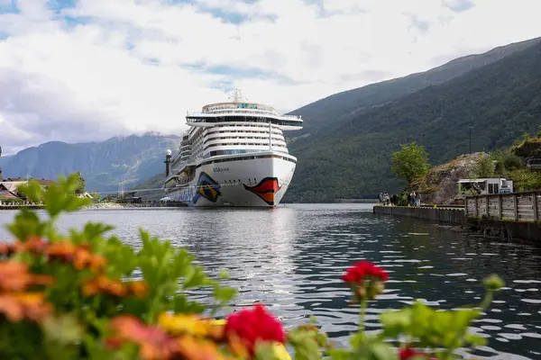 Cruise ship docked in the port of Flam in summer in Sognefjord, Norway.