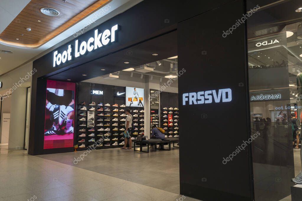 Bali, Indonesia - Dec 17, 2024: Icon Bali Mall in Bali. Store front for Foot Locker with a large sign that says Frssvd. There are people inside the store