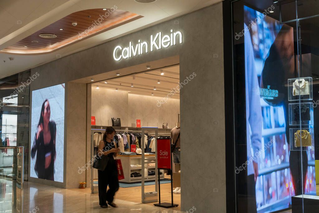 Bali, Indonesia - Dec 17, 2024: Icon Bali Mall in Bali. Woman walks into a store with a sign that says 
