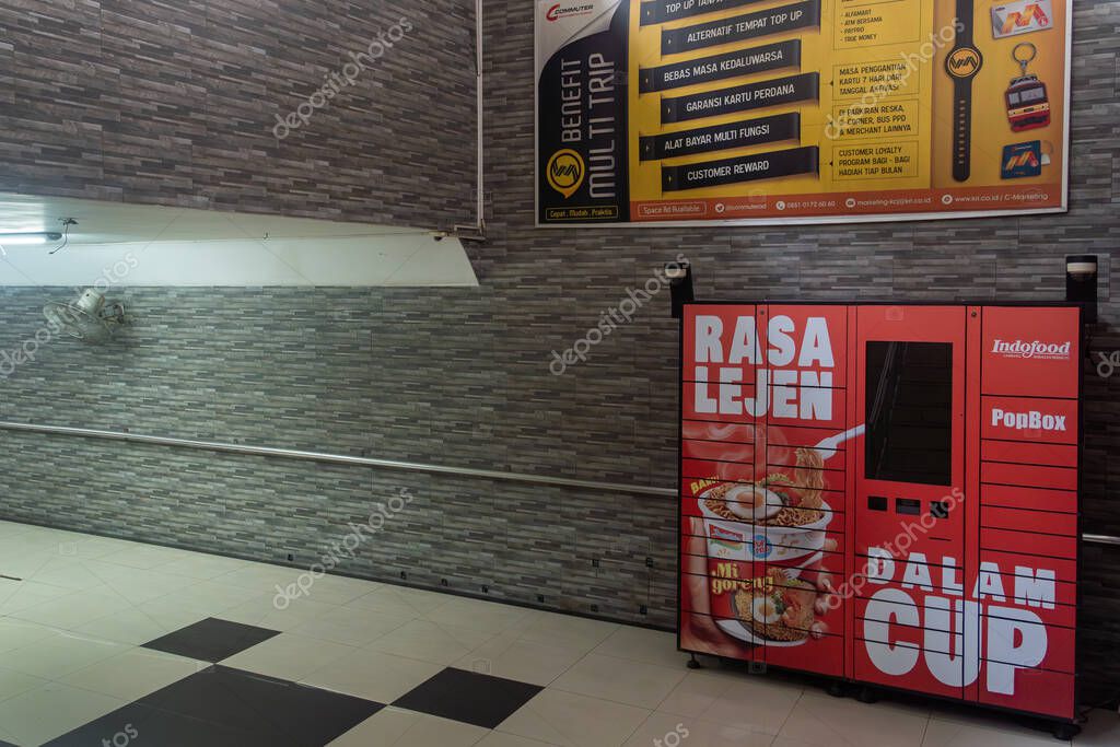Jakarta, Indonesia - February 1, 2025: Red vending machine with a sign that says 