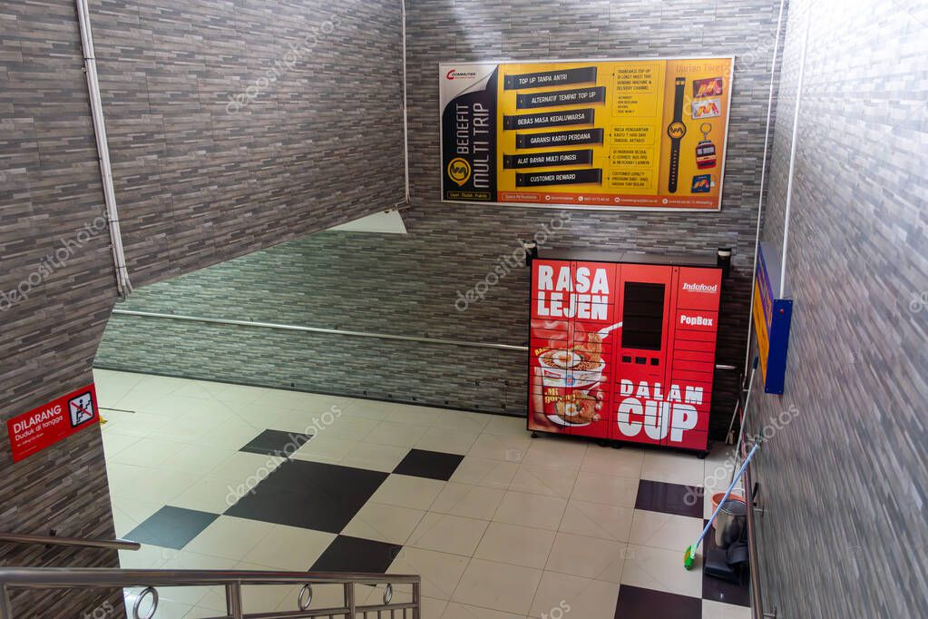 Jakarta, Indonesia - February 1, 2025: Red vending machine with a sign that says 