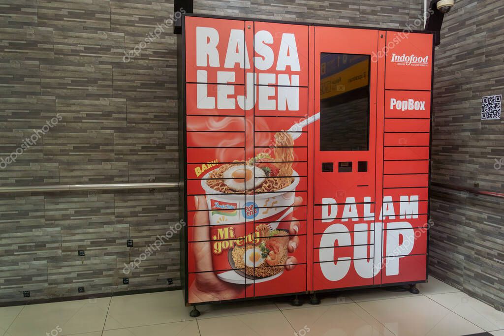 Jakarta, Indonesia - February 1, 2025: Red vending machine with a sign that says 