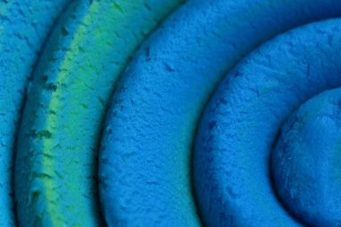 Oyun hamuru modelleme kil spiral içine yuvarlandı üst ayrıntılı görünüm dokusu arkaplan yeni olo rengi. Sahte yeni olo rengi örneği. Bağlayıcı resim.