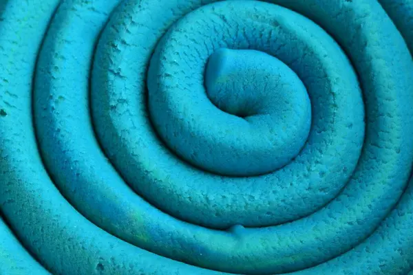 Oyun hamuru modelleme kil spiral içine yuvarlandı üst ayrıntılı görünüm dokusu arkaplan yeni olo rengi. Sahte yeni olo rengi örneği. Bağlayıcı resim.