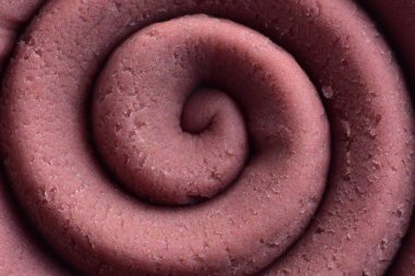 Hamur modelleme kil sarmal içine yuvarlandı üst ayrıntılı görünüm dokusu arka plan pembe