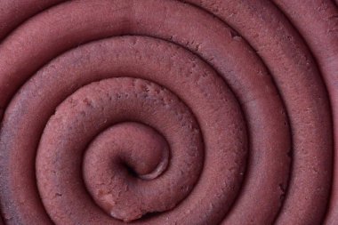 Hamur modelleme kil sarmal içine yuvarlandı üst ayrıntılı görünüm dokusu arka plan pembe