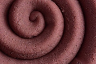 Hamur modelleme kil sarmal içine yuvarlandı üst ayrıntılı görünüm dokusu arka plan pembe