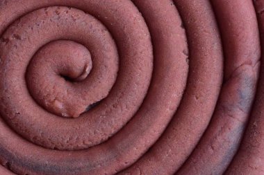 Hamur modelleme kil sarmal içine yuvarlandı üst ayrıntılı görünüm dokusu arka plan pembe