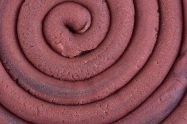 Hamur modelleme kil sarmal içine yuvarlandı üst ayrıntılı görünüm dokusu arka plan pembe