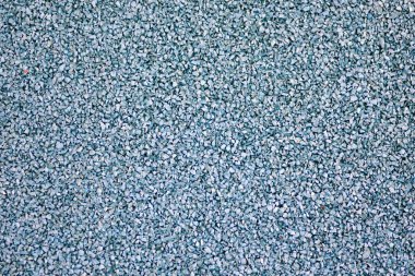 Mavi spor lastik kaplama kaplama yakın. Oyun alanı kaldırım arkaplan dokusu.