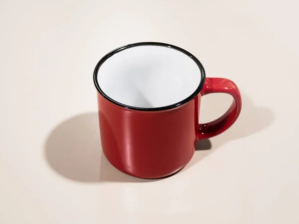 red enamel coffee cup isolated with shadow