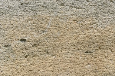 Eşsiz doku ve renkleri gösteren sert taş bir duvarı kapat