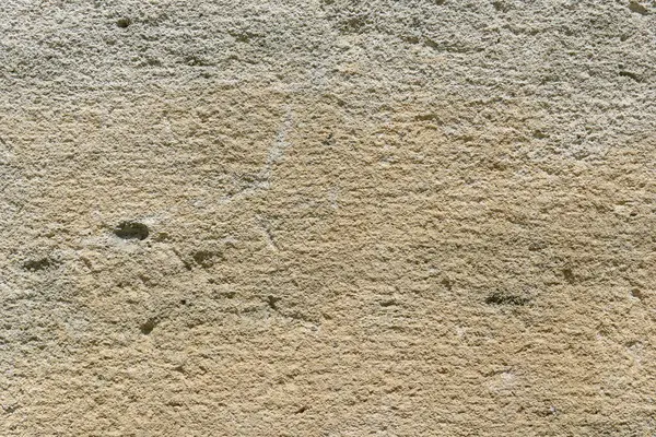 Eşsiz doku ve renkleri gösteren sert taş bir duvarı kapat