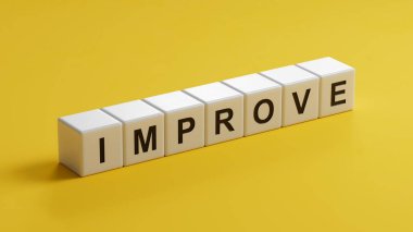 IMPROVE kelimesi ahşap küpten yapılmıştır. Tahta küplere yakın plan, sarı arkaplanda 3D İş Konsepti.