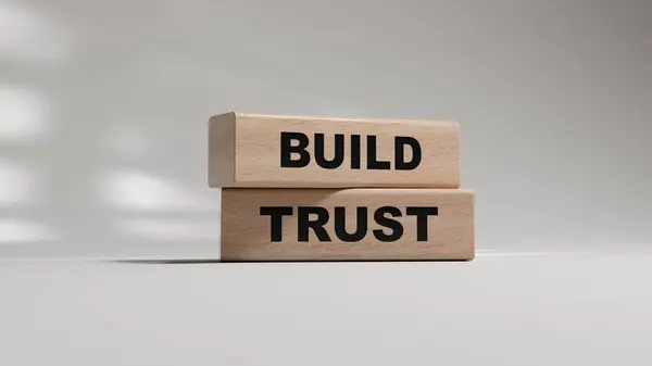 Güven sembolü oluştur. Sözcüklerle ahşap bloklar güven inşa et. İş ve güven kavramı oluştur. Uzayı kopyala Beyaz arkaplanda kavramsal 3D görüntüleme.