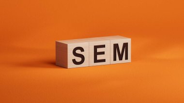 SEM sembolü. SEM kavramını kullan. Tahta küpler ve bloklar üzerine arama motoru pazarlaması. İş ve arama motoru pazarlama - SEM konsepti. Turuncu arkaplana 3D kopyala.