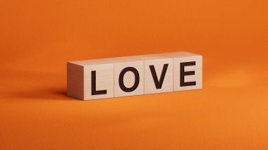 Aşk.ahşap küpler. Yukardan tahta küp düğmeleri üzerinde düz bir görünüm var. bilişim teknolojisi kavramı turuncu arka planda 3D yorumlama.