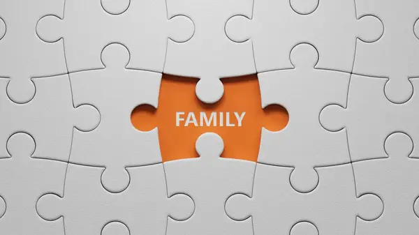 Aile. Yazılışı eksik olan beyaz yapboz parçaları. Turuncu arkaplandan bakıldığında, üzerinde eksik düğmeleri olan beyaz bulmaca parçaları görülüyordu..