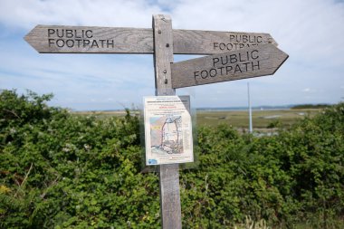West Wittering, West Sussex, England. June 17th 2025. Footpath signpost with a notice warning of temporary footpath closure.