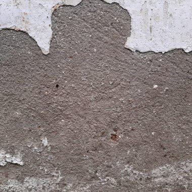 Çizik ve çatlaklarla dolu beton doku.