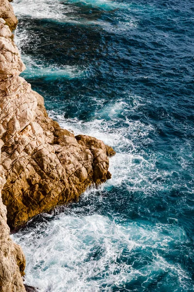 Water and rocks. Top view of the Adriatic Sea