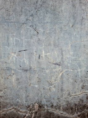 Çatlak ve soyulmuş beton duvar dokusu.