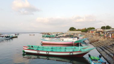 Traditional Wooden Fishing Boats Resting Peacefully on the Bay