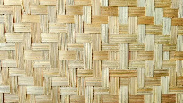 Geleneksel bambu dokusunun yakın çekimi. Çevre dostu ürün ambalajlama, sürdürülebilir markalaşma ve organik tasarım projeleri için mükemmel doğal arka plan