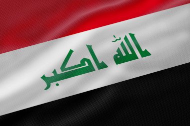 Üzerinde kırmızı, beyaz ve siyah renkli yeşil Arapça yazı bulunan Irak bayrağını çaprazlama sallıyordu..