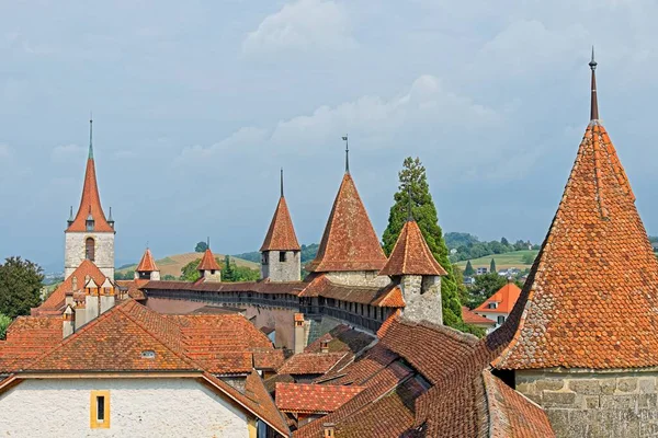 stock image Defensive walls, towers and red roofs of old town Murten in Switzerland.