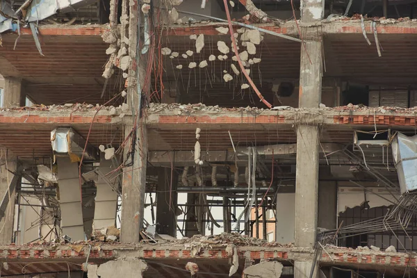 stock image Old building being demolished to make room for new architecture. Construction Demolition Site. Destroyed building, can be used as demolition, earthquake, bomb, terrorist attack or natural disaster