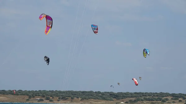 stock image Kitesurf kites against clear sky. Kites flying in air scenic background.  Imbros Island. Gokceada, Canakkale Turkey 08.20.2022